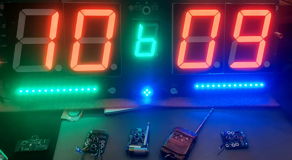 Bare development boards and a wireless remote module under bench testing during pickleball scoring system firmware validation