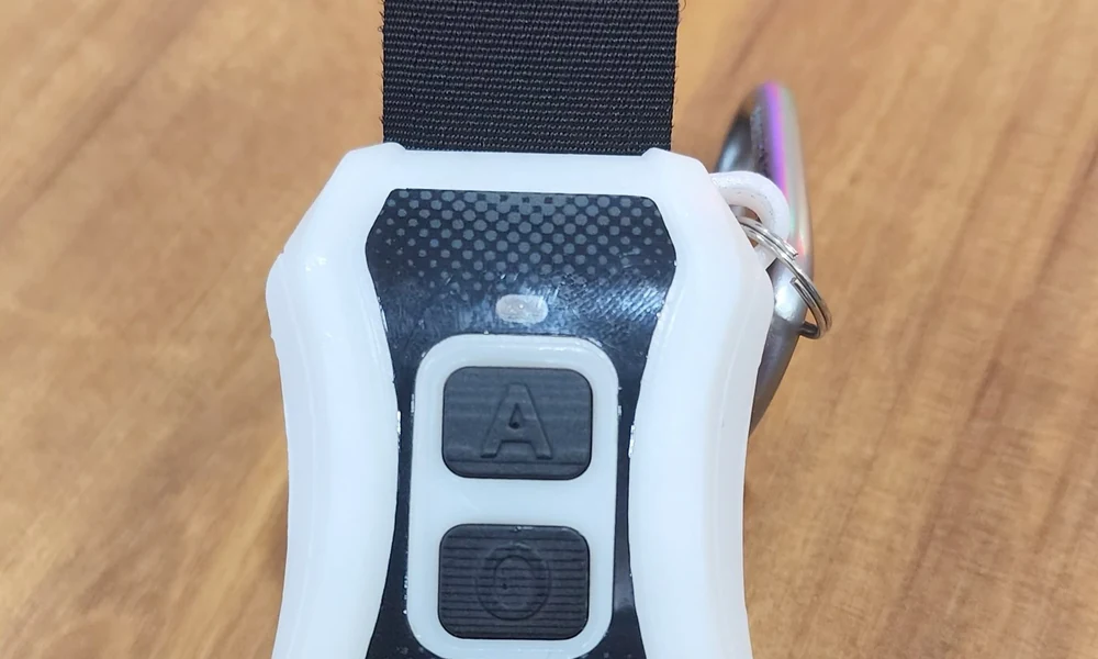 Close-up of the IoT pickleball scoring wristband and wireless sync remote