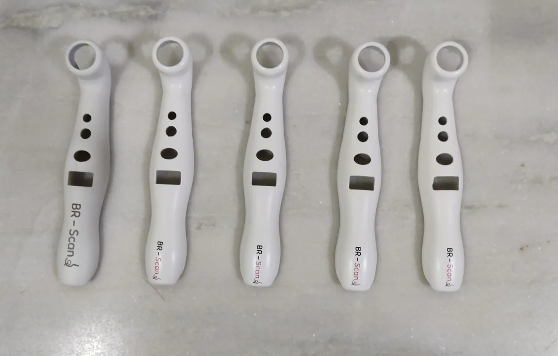 Five white BR-Scan housings with openings for the LED head, buttons and display