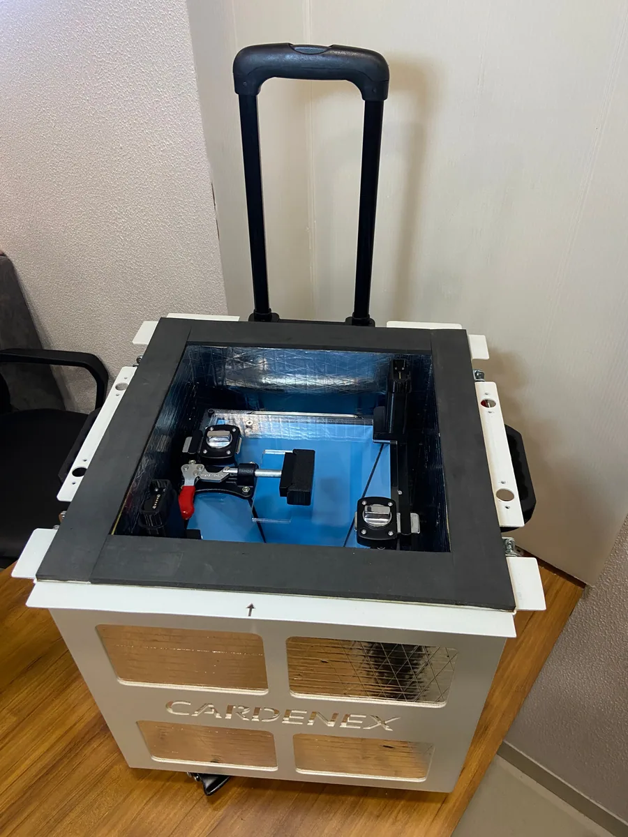 Open organ transport box showing its insulated interior and internal frame