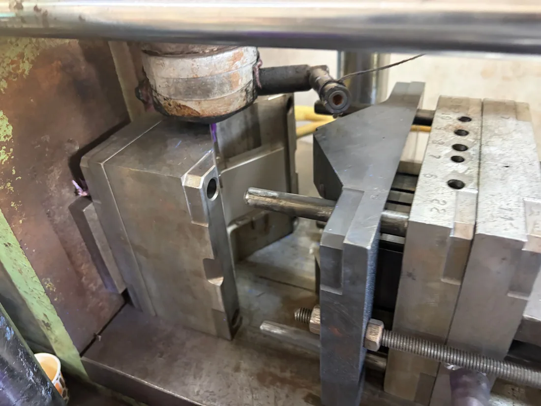 Injection mold mounted in a molding machine