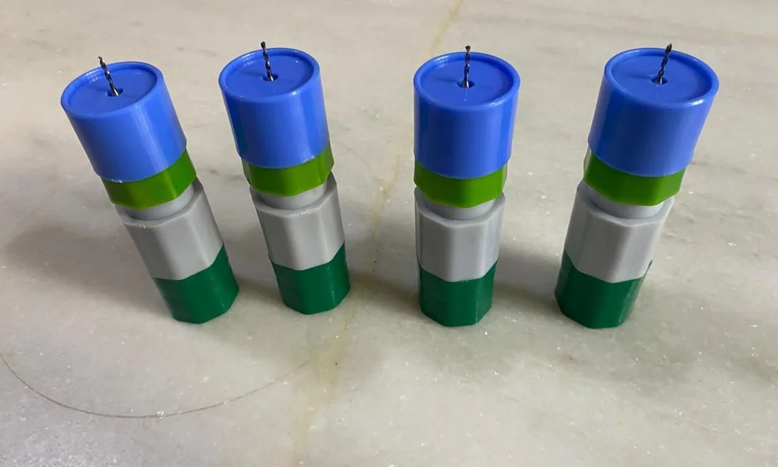 Four assembled injection-molded Hobby Helper handles standing in a row