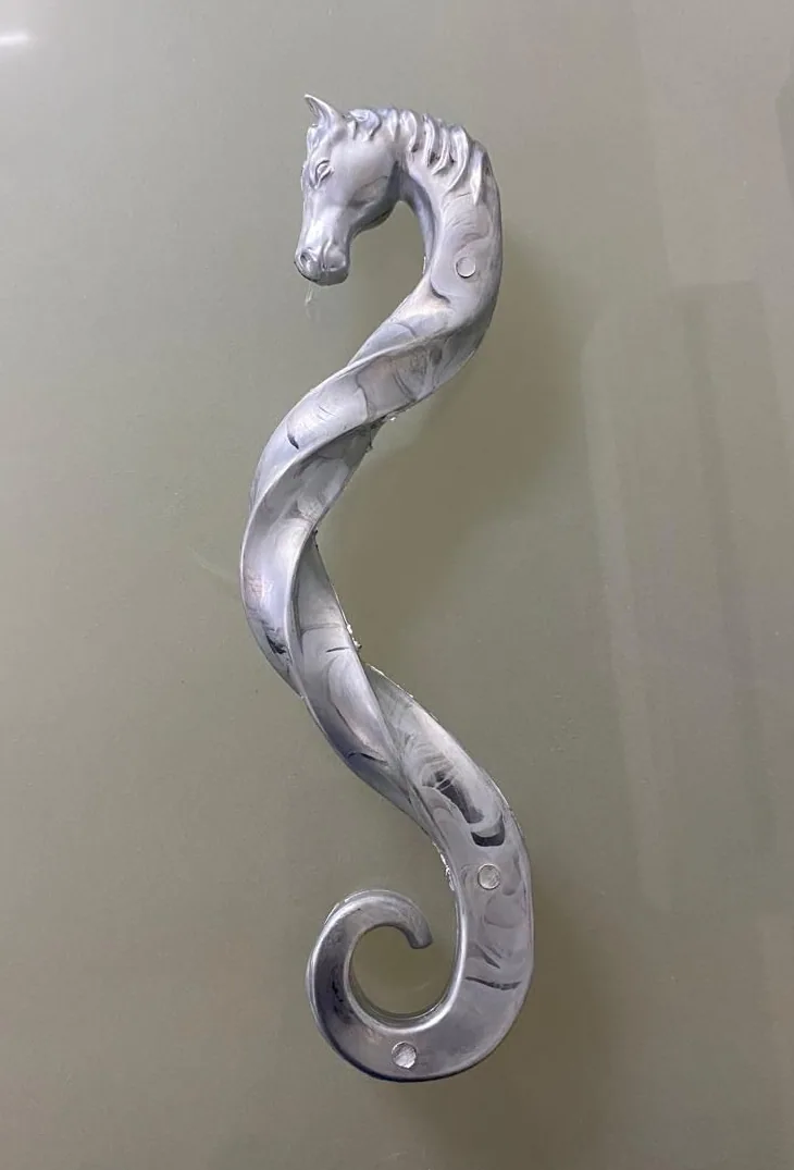 Raw zinc die-cast handle before finishing