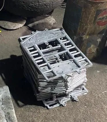 Aluminum die-cast panels stacked after casting