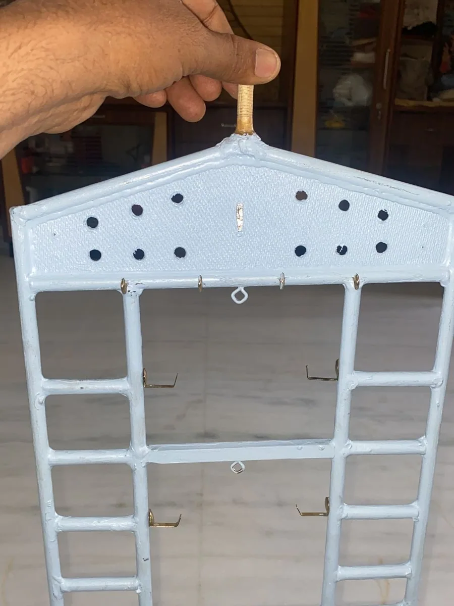 Prototype hanger panel held up by its mounting pin
