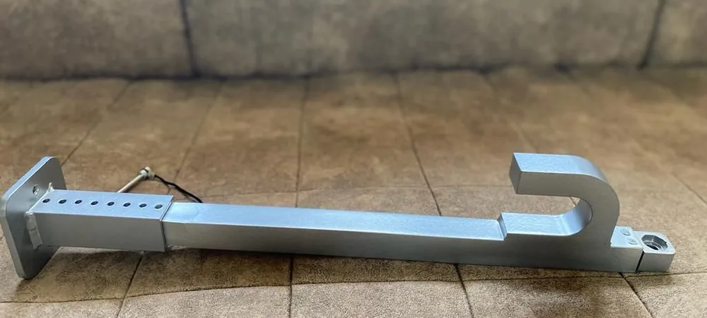 Prototype of the telescopic aluminum arm with its adjustment holes and hook