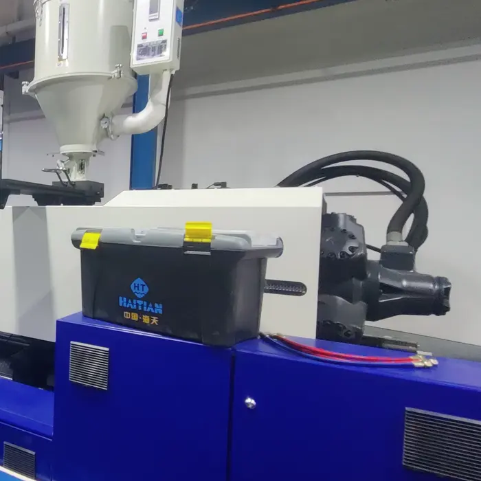 An injection moulding machine running on the production floor